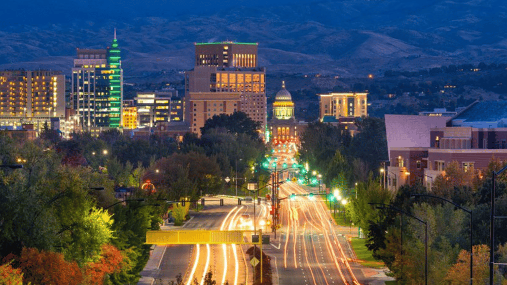 The city of Boise, Idaho at dusk with mountains in the background represent Ascend Adwerks' focus on local businesses.
