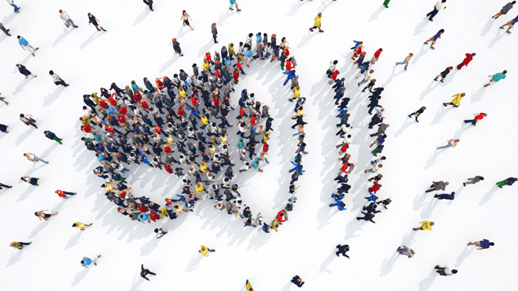 A large group of people are seen in the shape of a megaphone, symbolizing PPC campaigns for the hospitality industry.