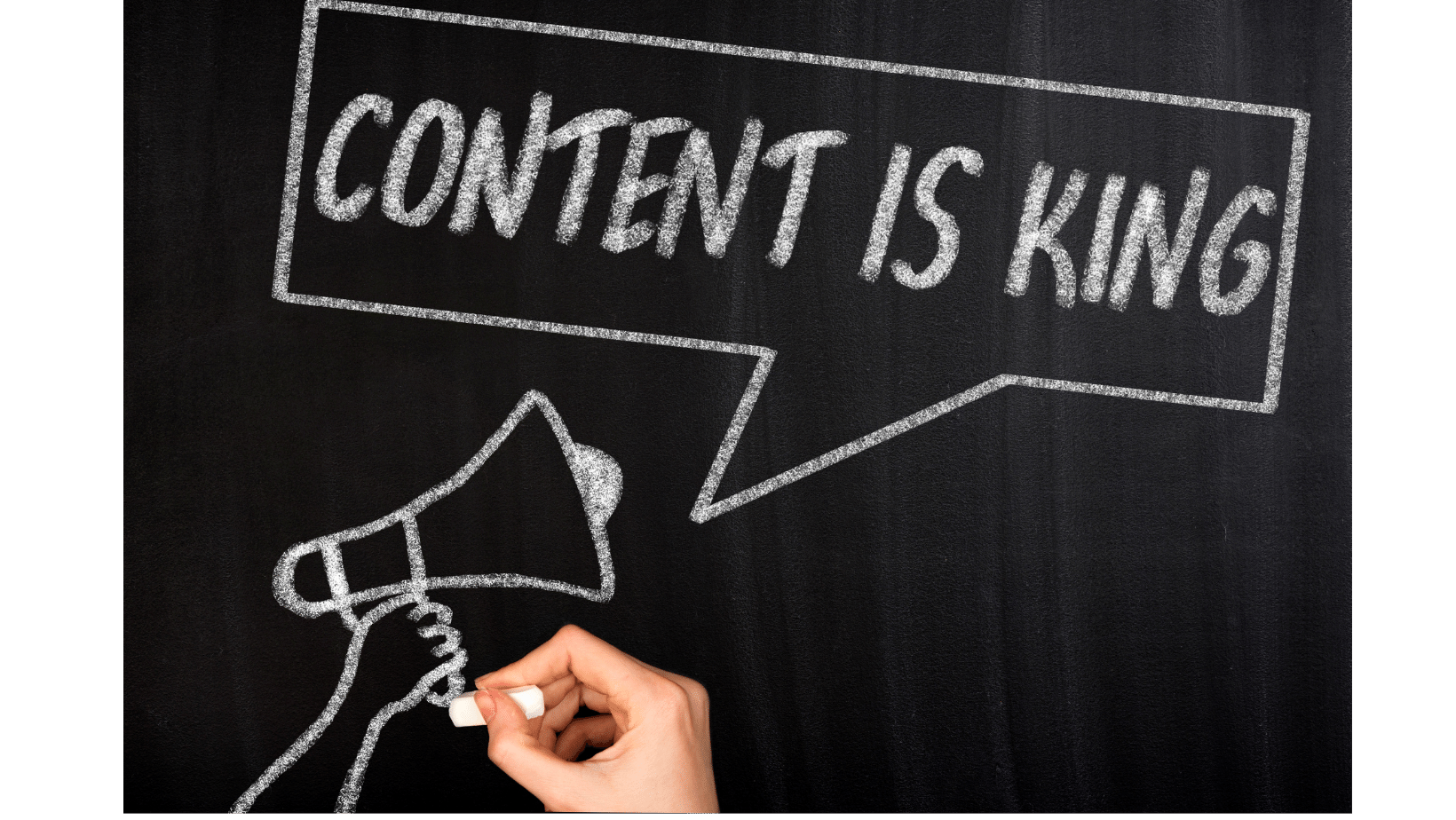 An image of. chalkboard with a hand drawing a microphone with 'Content is King' in parenthesis. 