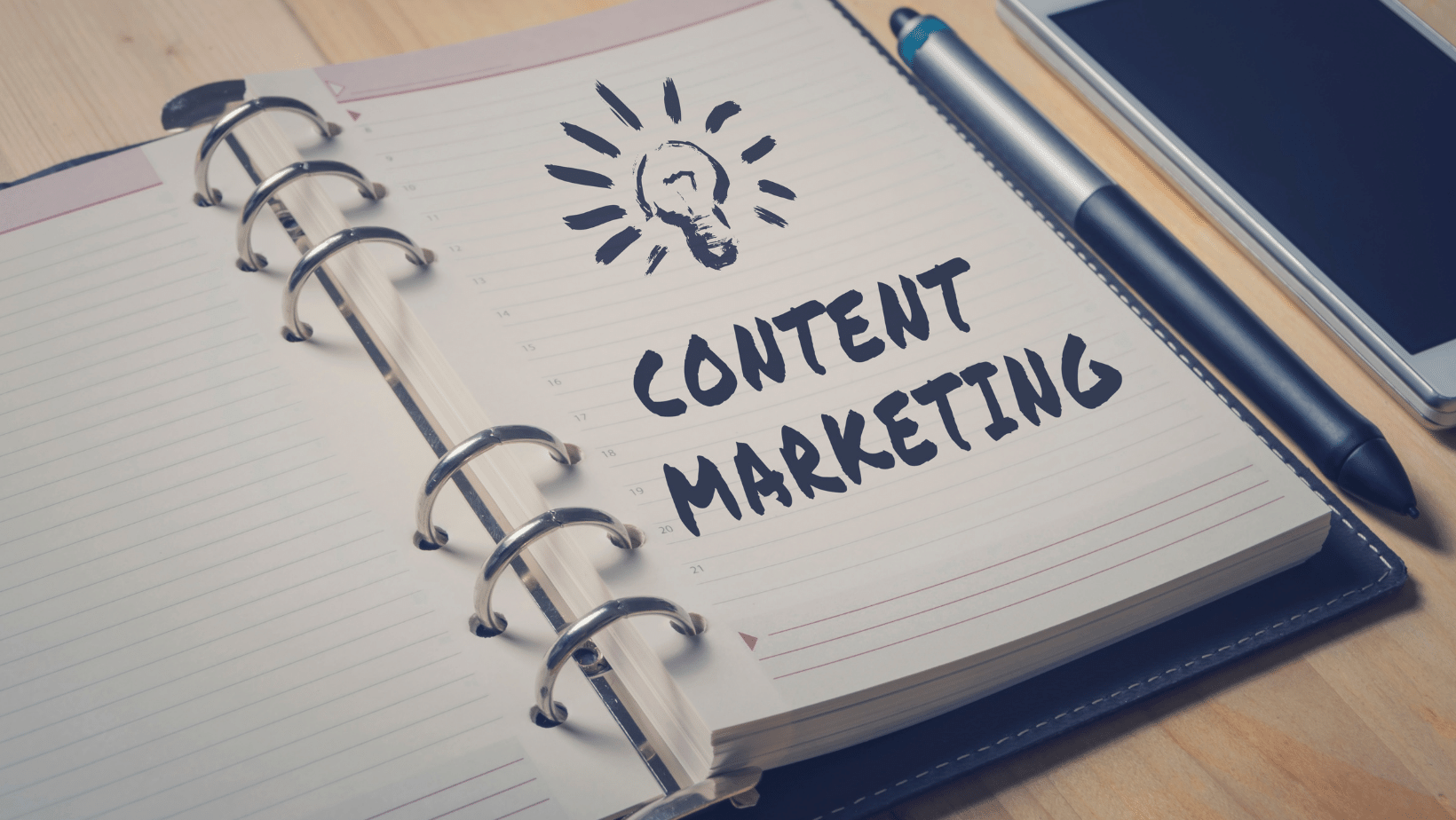Ascend Adwerks' notebook with 'Content Marketing' written on the page.