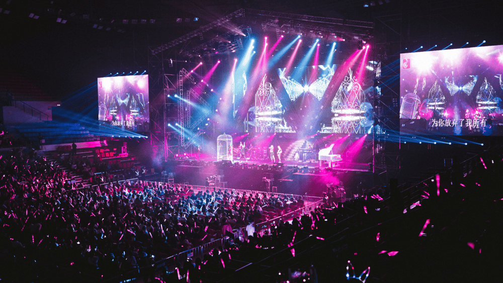 An Ascend Adwerks' image of a concert with pink and purple lights symbolizing Ascend Adwerks' Entertainment Marketing Services and Solutions.