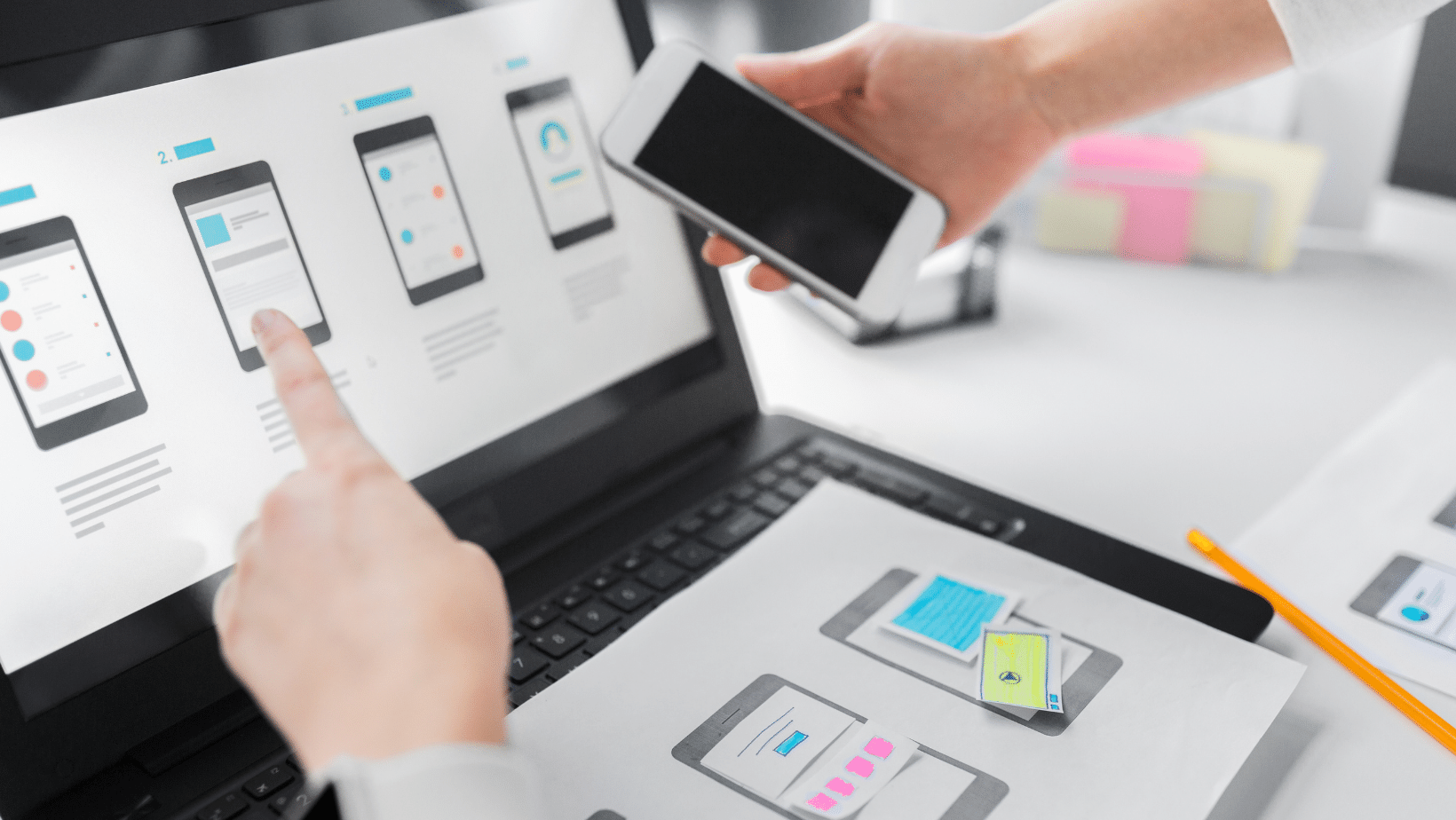 Ascend Adwerks' designs of a website layouts on a mobile device for optimization.