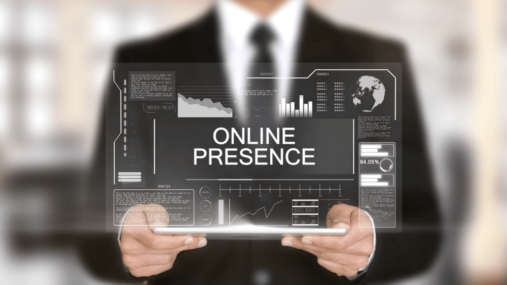 A businessman holding tablet with online presence concept stock photo.