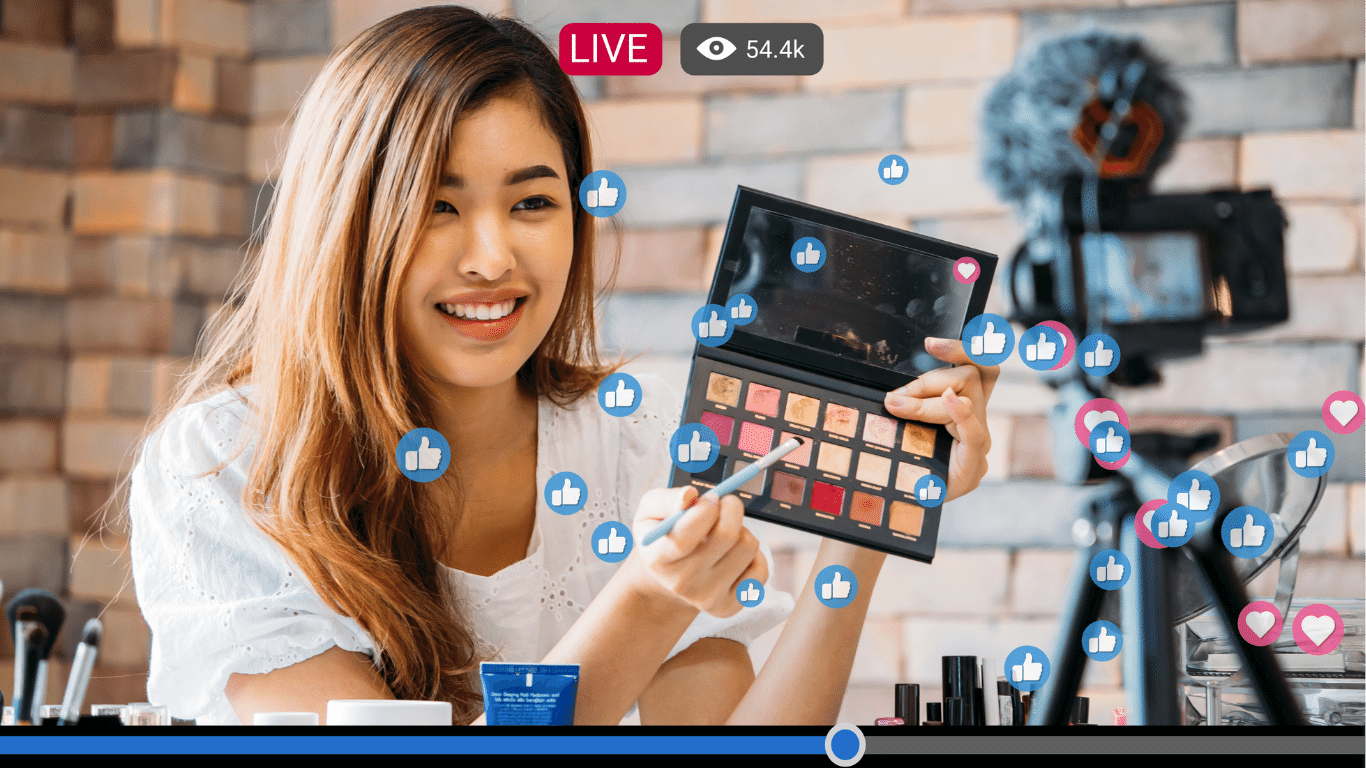 Ascend Adwerks image for Ascend Video Solutions: Woman live streaming makeup tutorial while using social media icons in Canva Editor.